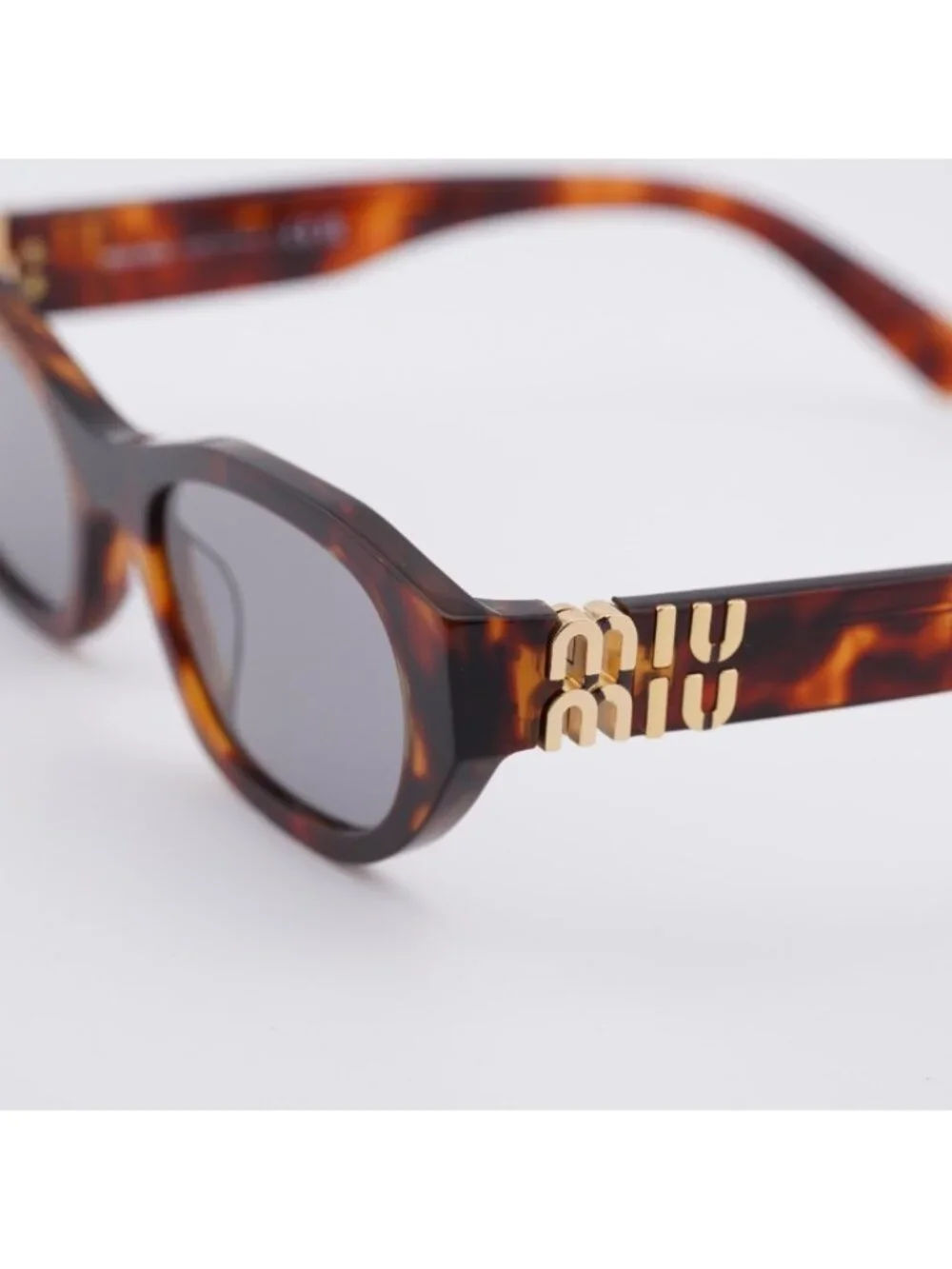 Miu Miu MUA03S 21C40O Sunglasses Havana Mahogany Oval Frame, Grey Lenses